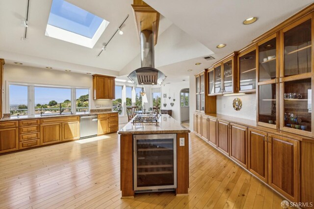 12553 Parker Ranch Ct, Saratoga, CA 95070 - kitchen with wine cooler, rail lighting, stainless steel appliances, a skylight, and lofted ceiling