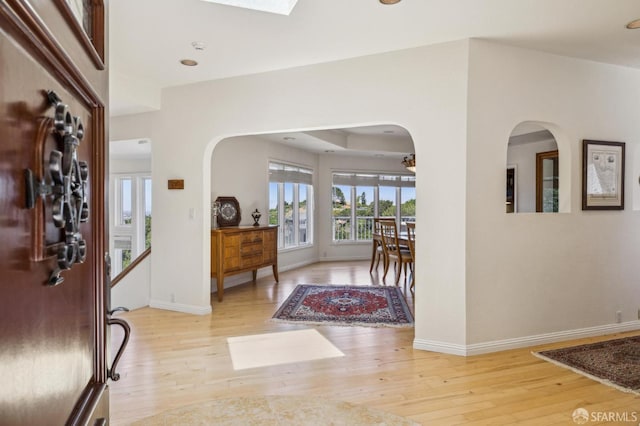 12553 Parker Ranch Ct, Saratoga, CA 95070 - foyer entrance with arched walkways, wood-type flooring, and baseboards