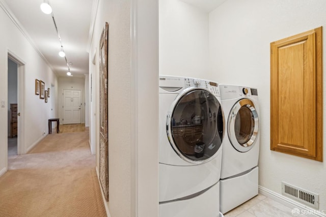 12553 Parker Ranch Ct, Saratoga, CA 95070 - laundry area with washing machine and dryer, baseboards, light colored carpet, and track lighting