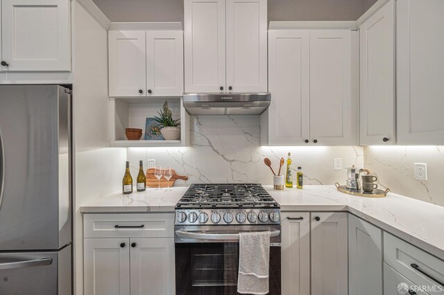 278 Whitney St, San Francisco, CA 94131 - kitchen featuring appliances with stainless steel finishes, under cabinet range hood, white cabinets, and light stone counters