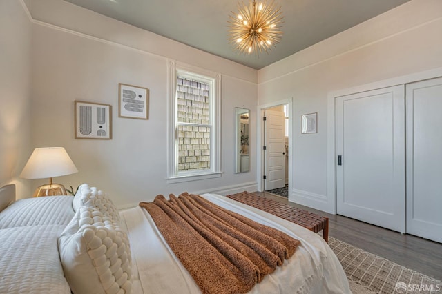 278 Whitney St, San Francisco, CA 94131 - bedroom featuring dark wood-style floors, a closet, and a chandelier