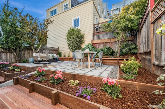 278 Whitney St, San Francisco, CA 94131 - fenced backyard with a patio, a vegetable garden, and an outdoor living space