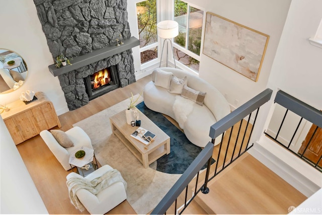 1945 Las Encinas Ct, Los Gatos, CA 95032 - living area featuring wood finished floors and a stone fireplace