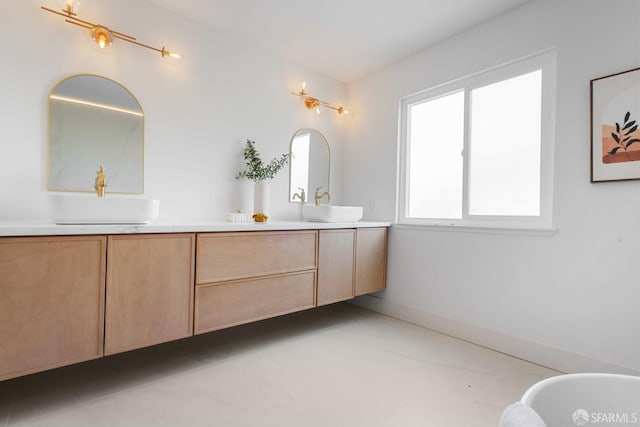 1945 Las Encinas Ct, Los Gatos, CA 95032 - bathroom featuring double vanity, a freestanding bath, and concrete flooring