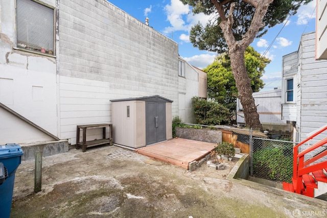 3328 San Jose Ave, Daly City, CA 94014 - view of patio / terrace featuring fence, an outbuilding, a deck, and a storage shed