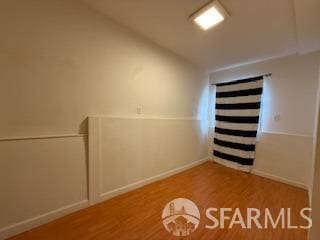 3328 San Jose Ave, Daly City, CA 94014 - empty room featuring baseboards, vaulted ceiling, and wood finished floors