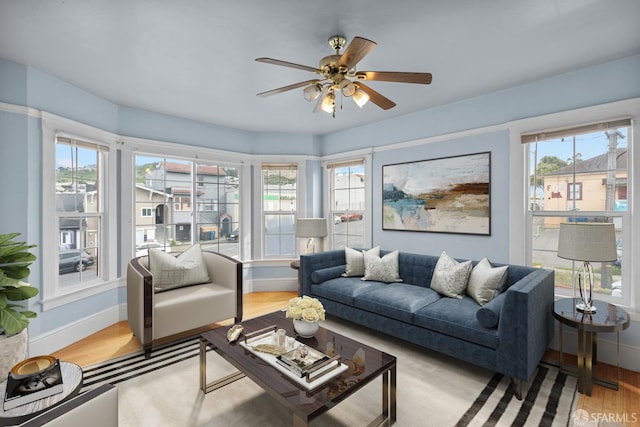 3328 San Jose Ave, Daly City, CA 94014 - living area with light wood-style floors, baseboards, a ceiling fan, and a healthy amount of sunlight