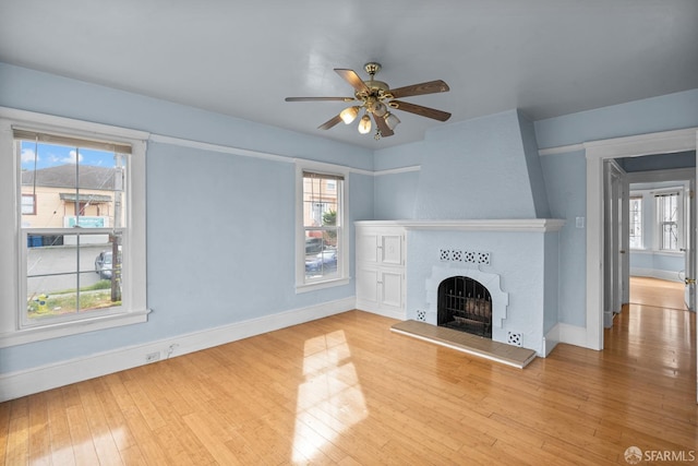 3328 San Jose Ave, Daly City, CA 94014 - unfurnished living room with baseboards, ceiling fan, hardwood / wood-style floors, and a fireplace