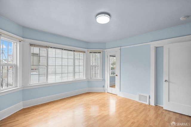 3328 San Jose Ave, Daly City, CA 94014 - empty room featuring baseboards, visible vents, a healthy amount of sunlight, and wood finished floors