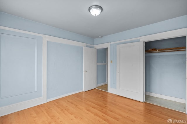 3328 San Jose Ave, Daly City, CA 94014 - unfurnished bedroom featuring a closet, light wood-style flooring, and baseboards