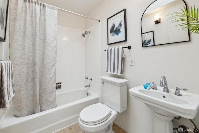 full bathroom with sink, shower / bath combo, and toilet