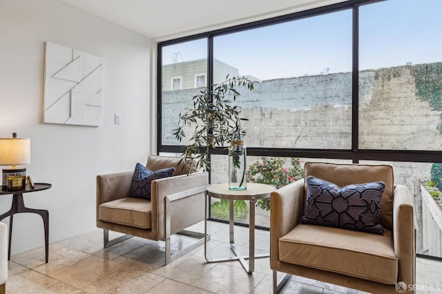 living area with a wall of windows