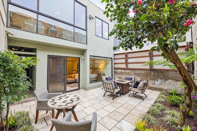 view of patio featuring an outdoor fire pit