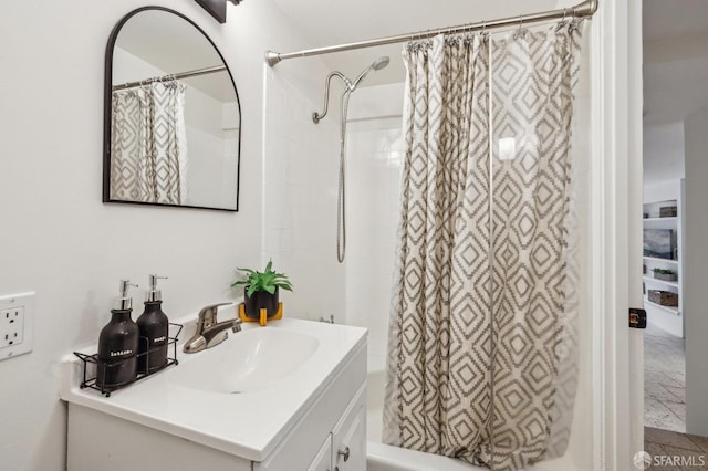 bathroom featuring vanity and shower / bath combination with curtain