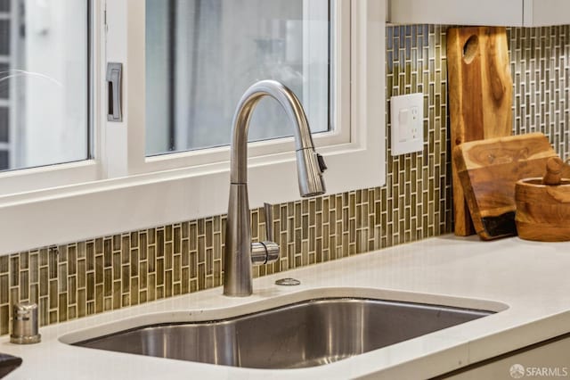 room details with sink and decorative backsplash