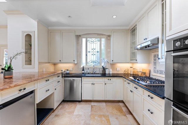 153 Dale Ave, San Carlos, CA 94070 - kitchen with appliances with stainless steel finishes, under cabinet range hood, decorative backsplash, arched walkways, and dark stone counters