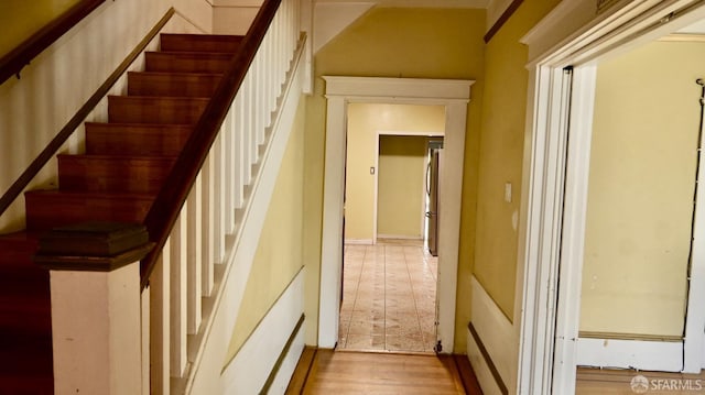 stairs featuring wood-type flooring