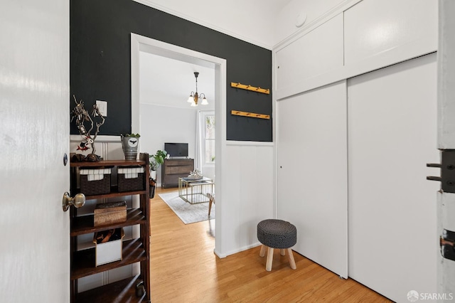 243 Henry St Unit A, San Francisco, CA 94114 - hallway featuring light wood-style flooring and a wainscoted wall