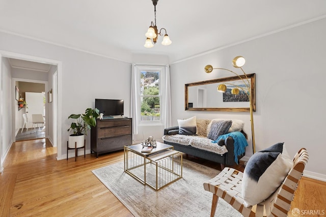 243 Henry St Unit A, San Francisco, CA 94114 - living room with light wood finished floors, a chandelier, and crown molding