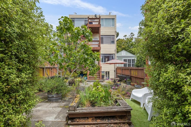 243 Henry St Unit A, San Francisco, CA 94114 - back of property featuring a vegetable garden and stairway