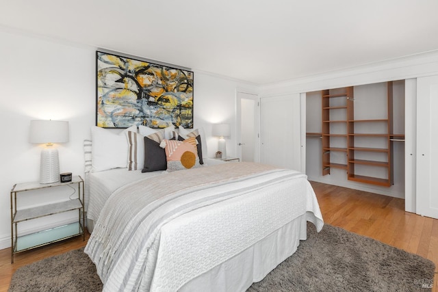 bedroom with wood finished floors