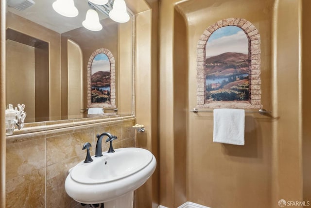 bathroom with visible vents and a sink