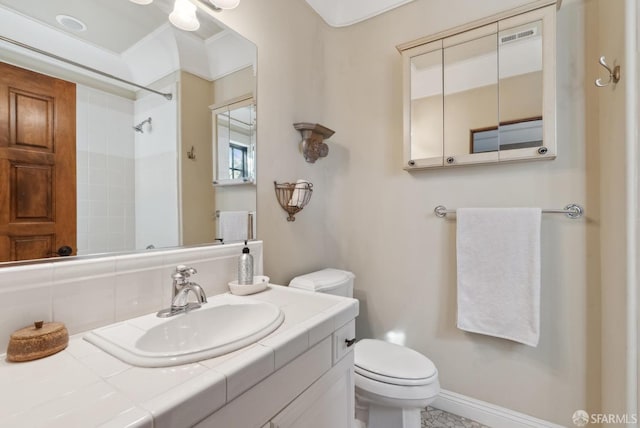 bathroom featuring visible vents, toilet, a shower, baseboards, and vanity