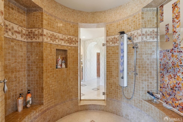 bathroom with a tile shower