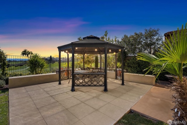 view of patio / terrace with a gazebo and fence