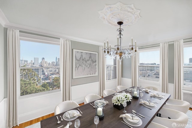 1800 Gough St Unit 7, San Francisco, CA 94109 - dining space with a chandelier, wood finished floors, a skyline view, and crown molding