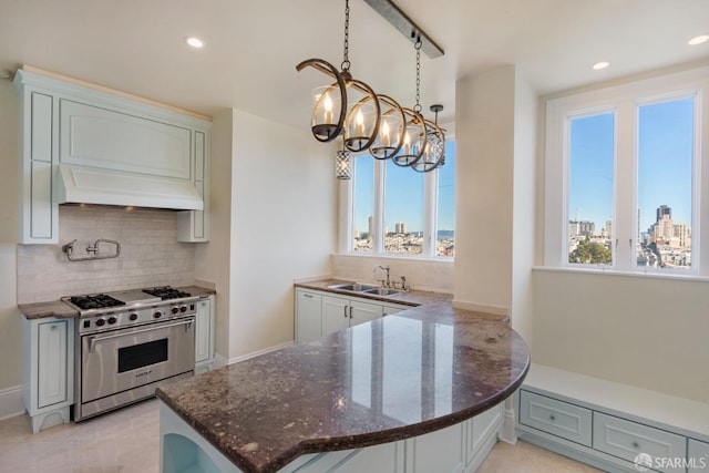 1800 Gough St Unit 7, San Francisco, CA 94109 - kitchen featuring designer stove, custom exhaust hood, plenty of natural light, decorative backsplash, and recessed lighting