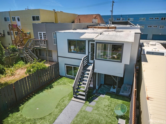 1278 La Playa St, San Francisco, CA 94122 - view of front facade featuring stairs, a putting area, stucco siding, and fence