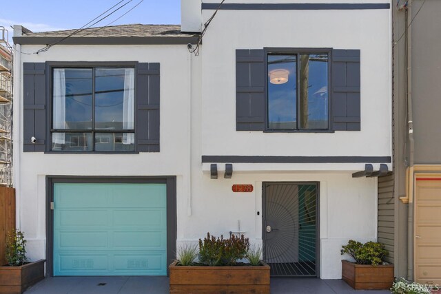 1278 La Playa St, San Francisco, CA 94122 - view of front of property featuring stucco siding and an attached garage