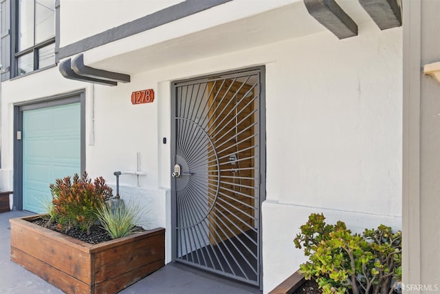 1278 La Playa St, San Francisco, CA 94122 - property entrance featuring stucco siding and a garage