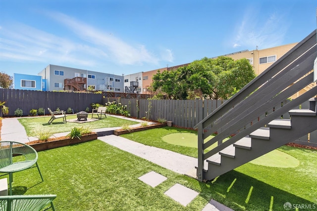 1278 La Playa St, San Francisco, CA 94122 - view of yard featuring a putting green, a fire pit, a patio area, and a residential view