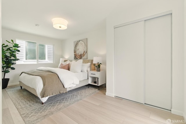 1278 La Playa St, San Francisco, CA 94122 - bedroom with a closet, light wood finished floors, and baseboards
