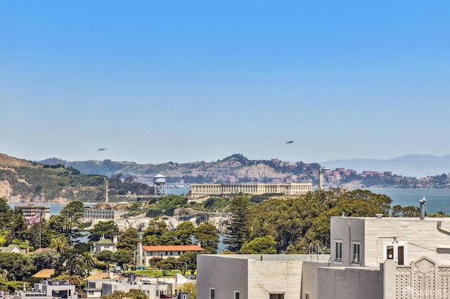 property view of mountains featuring a water view and a city view