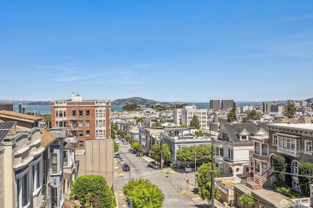 property's view of city featuring a mountain view