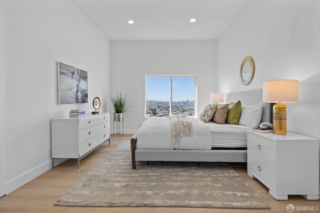 226 Rutledge St, San Francisco, CA 94110 - bedroom with baseboards, light wood-style floors, and recessed lighting