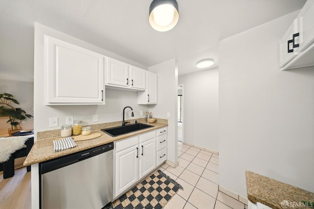 16006 E 14th St Unit 101, San Leandro, CA 94578 - kitchen featuring dishwasher, a sink, white cabinetry, light countertops, and light tile patterned floors