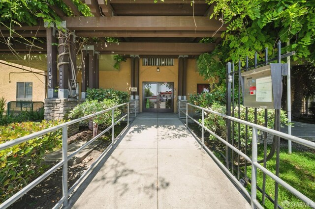 16006 E 14th St Unit 101, San Leandro, CA 94578 - view of exterior entry featuring stucco siding