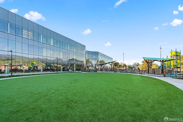 surrounding community featuring fence and playground community