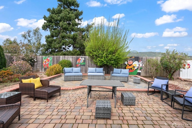 view of patio featuring a fenced backyard and outdoor lounge area