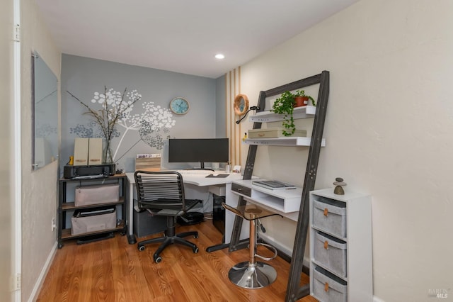 office with baseboards and wood finished floors