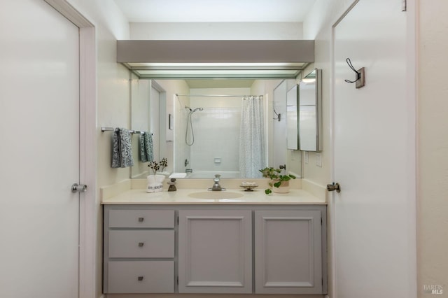 full bathroom with curtained shower and vanity