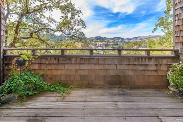 wooden terrace featuring a mountain view