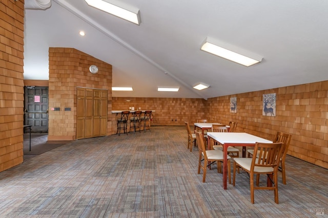 dining room featuring vaulted ceiling