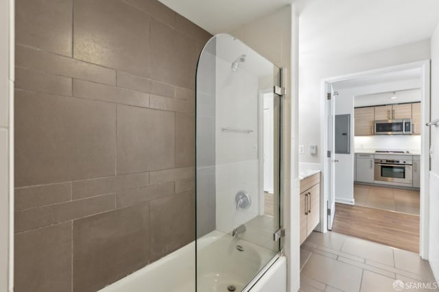 full bathroom featuring combined bath / shower with glass door, tile patterned floors, and vanity