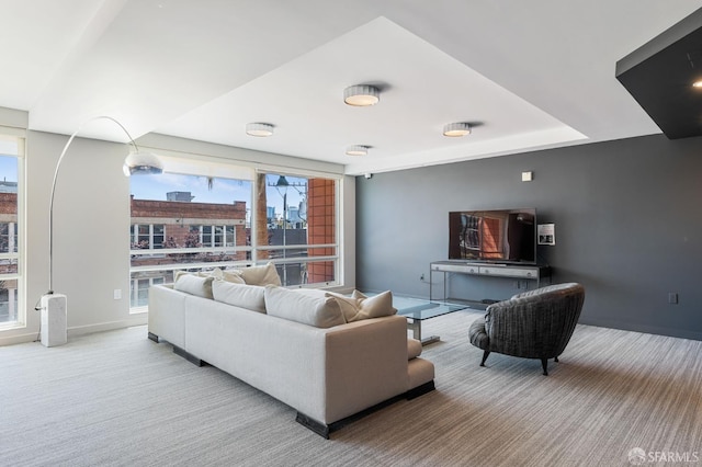 living room with carpet floors and baseboards