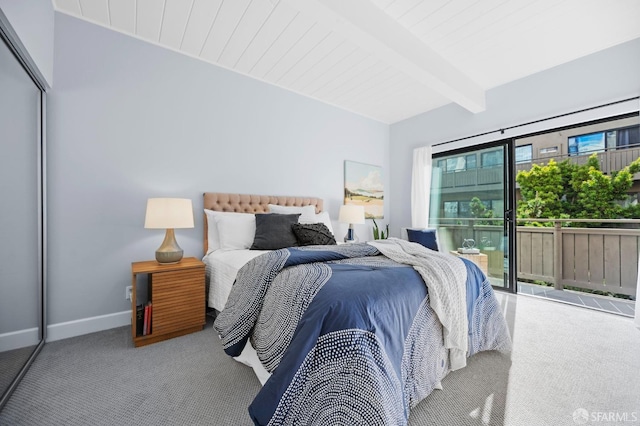 carpeted bedroom with access to outside, multiple windows, a closet, and beam ceiling